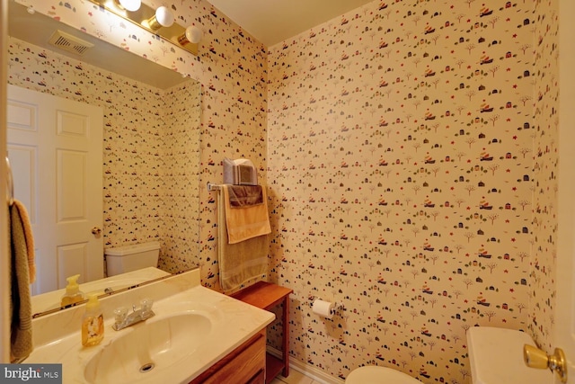 bathroom with vanity and toilet