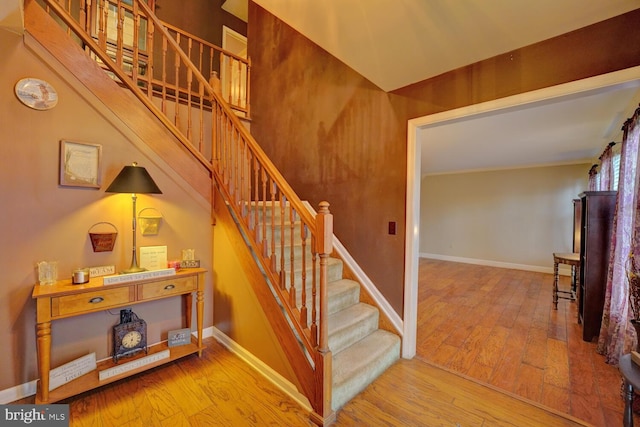 staircase featuring hardwood / wood-style floors