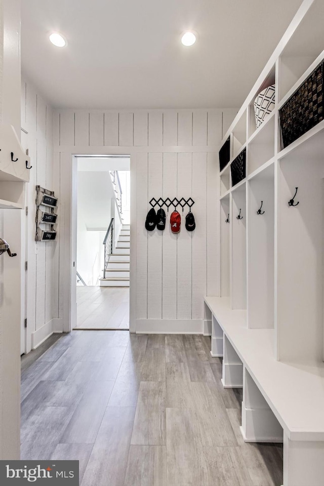 mudroom with light hardwood / wood-style floors