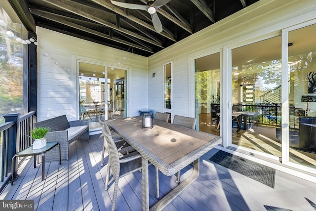 wooden deck with an outdoor hangout area and ceiling fan