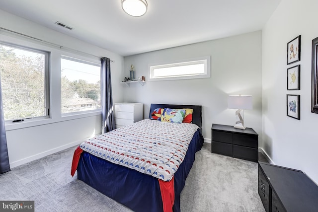 bedroom featuring light colored carpet