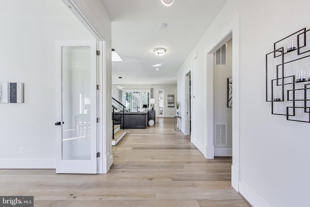 hall featuring light hardwood / wood-style floors