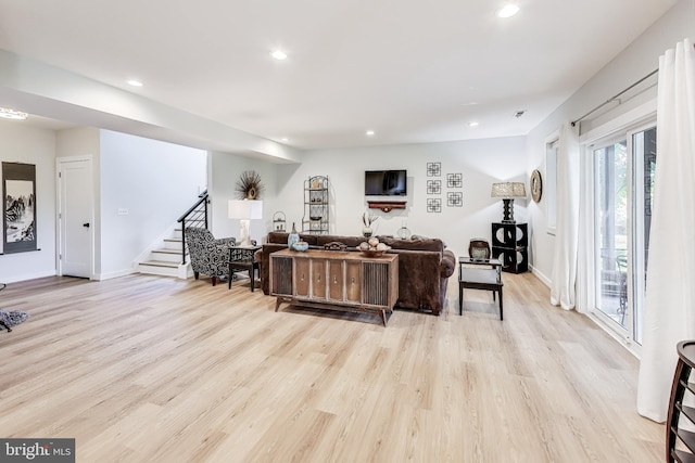 living room with light hardwood / wood-style floors