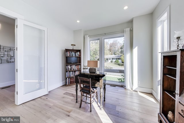 dining room with light wood-type flooring