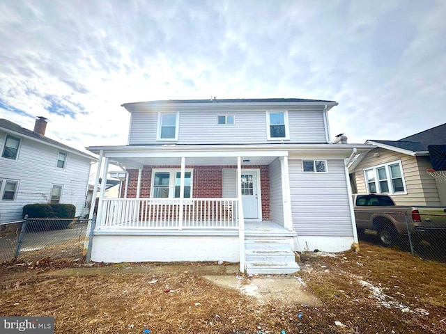 back of house featuring covered porch