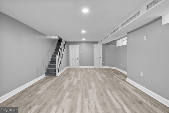 basement featuring light hardwood / wood-style floors