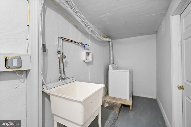 washroom with washer / dryer and sink