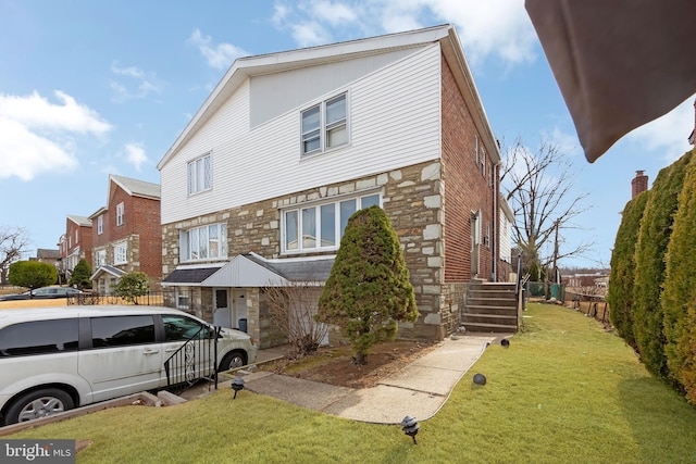 view of front of property with a front lawn