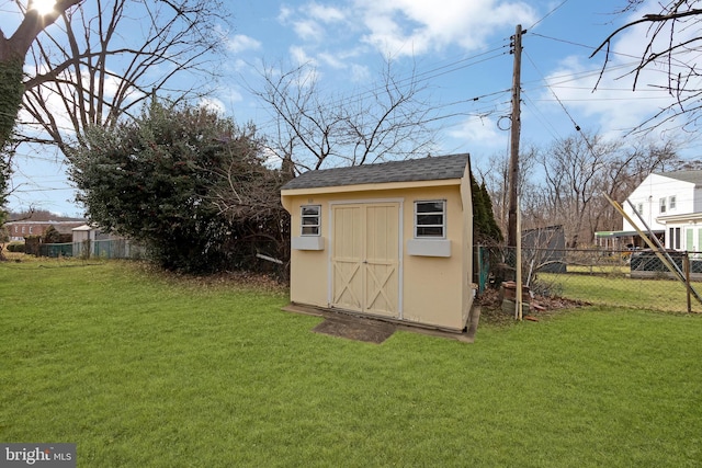 view of outbuilding with a lawn