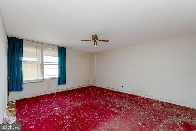 unfurnished room featuring carpet and ceiling fan