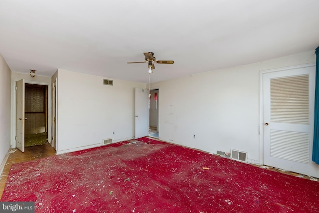 interior space with ceiling fan