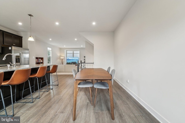 dining room with light wood-type flooring