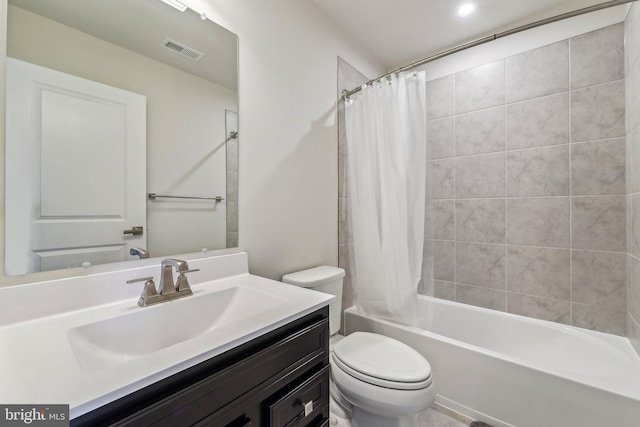 full bathroom with vanity, toilet, and shower / bath combo with shower curtain