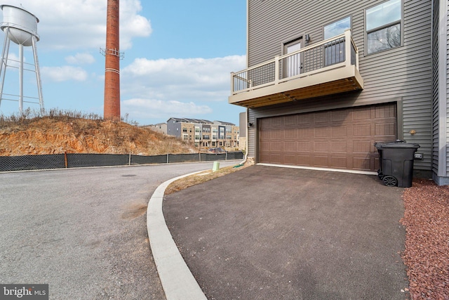 view of property exterior with a garage