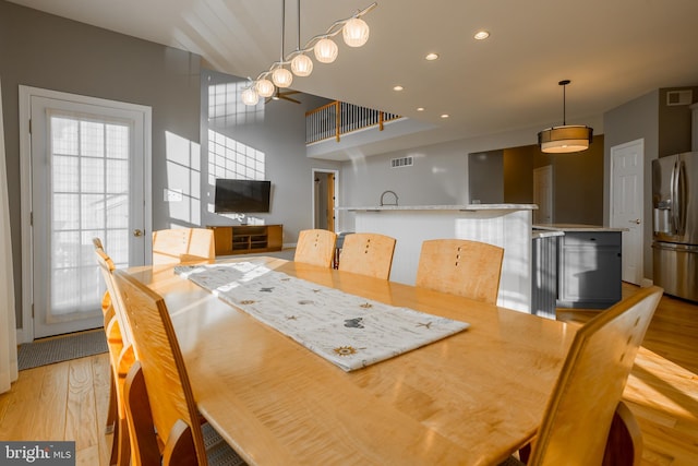 dining room with light wood-type flooring