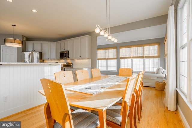 dining space featuring light hardwood / wood-style floors