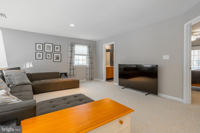 living room featuring light colored carpet