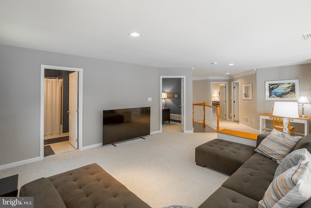 carpeted living room with crown molding