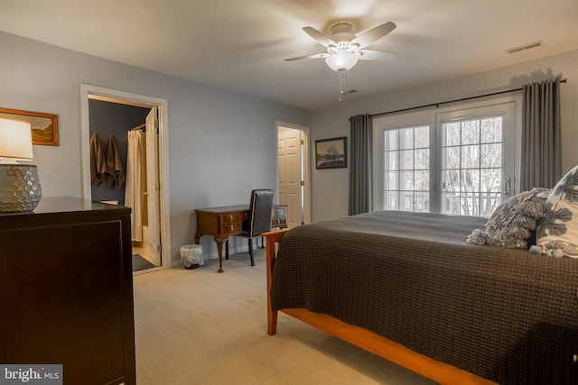 bedroom with light carpet and ceiling fan