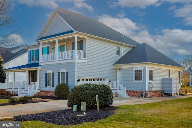 exterior space featuring a garage and a lawn