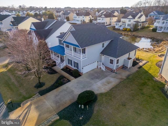 drone / aerial view featuring a water view