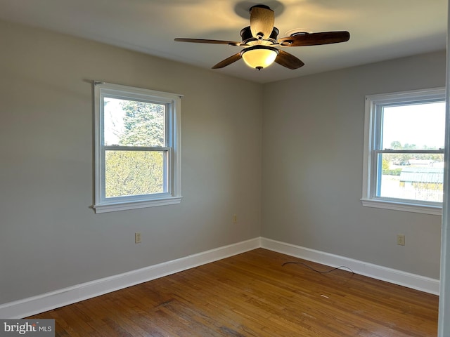 unfurnished room featuring hardwood / wood-style flooring and ceiling fan