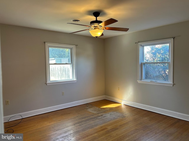 unfurnished room with wood-type flooring and ceiling fan