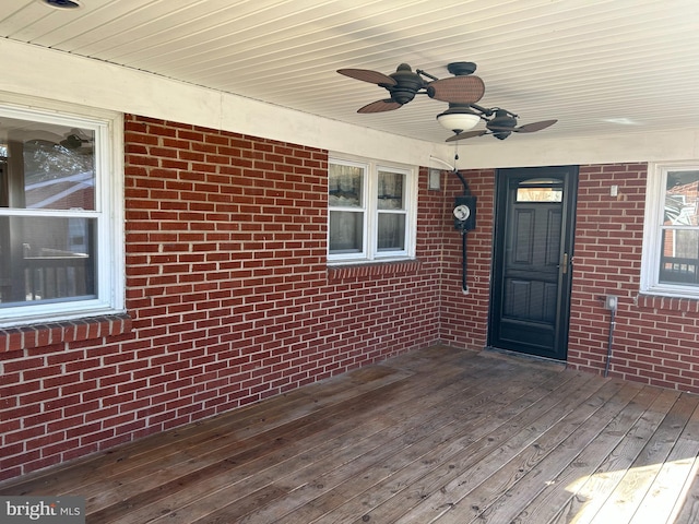 exterior space with ceiling fan