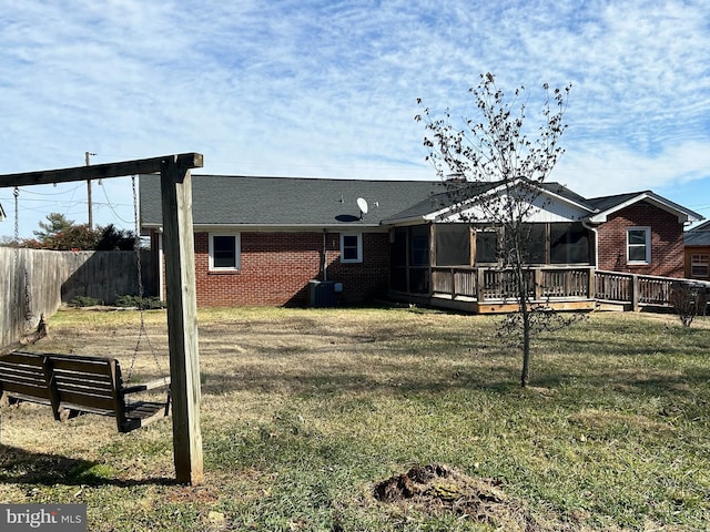 view of yard with cooling unit and a deck