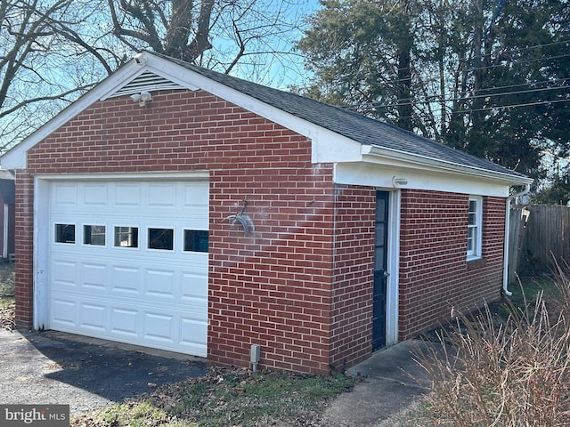 view of side of home with an outbuilding and a garage