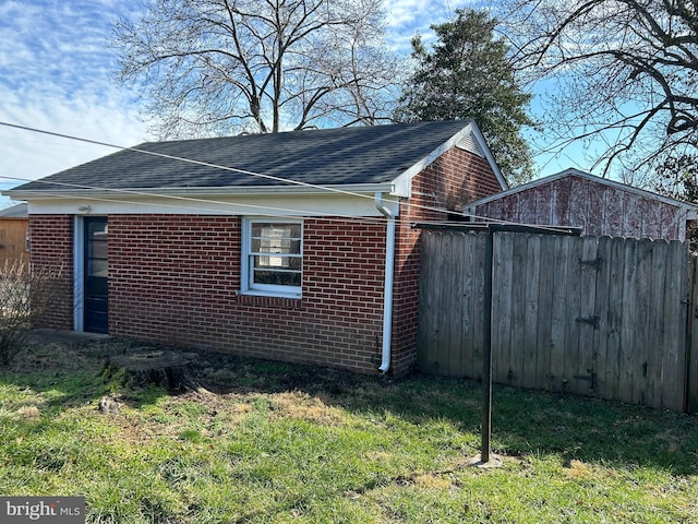 view of property exterior featuring a lawn