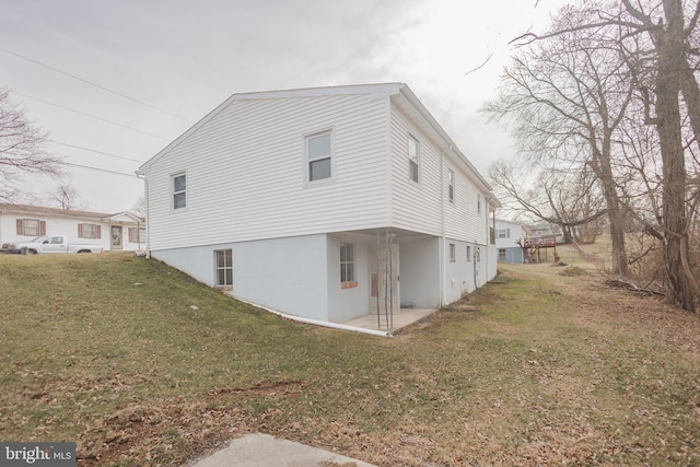 view of property exterior with a yard