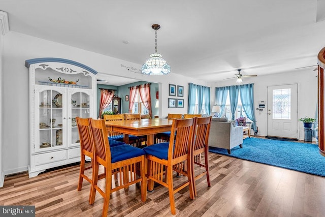 dining space featuring hardwood / wood-style flooring and ceiling fan