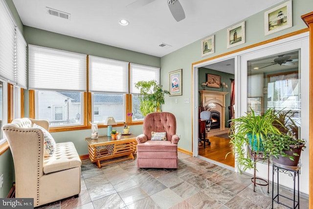 sitting room with ceiling fan