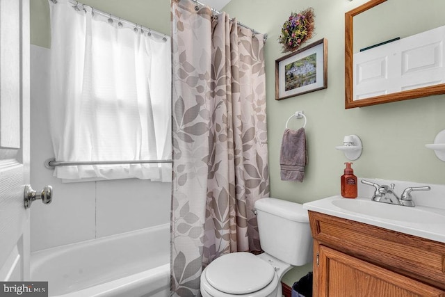 full bathroom with vanity, toilet, and shower / tub combo