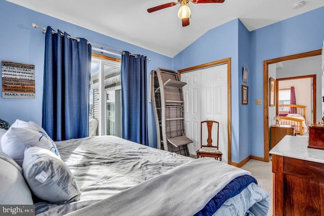 carpeted bedroom with vaulted ceiling, ceiling fan, and a closet