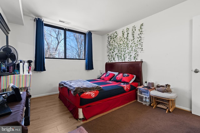 bedroom featuring hardwood / wood-style floors