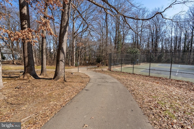 surrounding community with tennis court