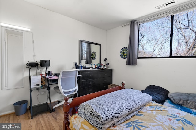 bedroom featuring wood-type flooring