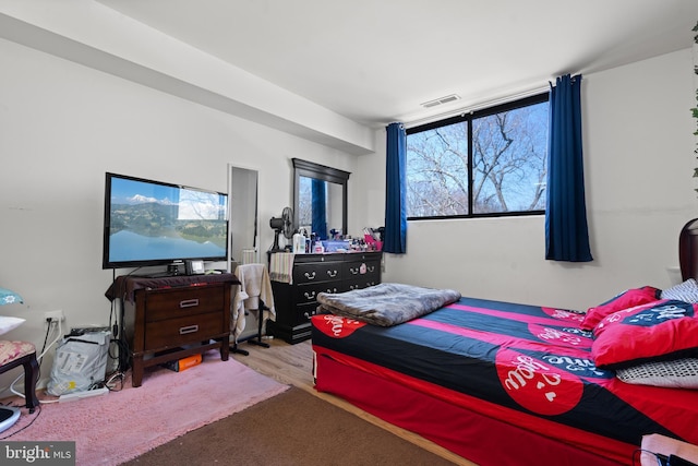 bedroom with light wood-type flooring