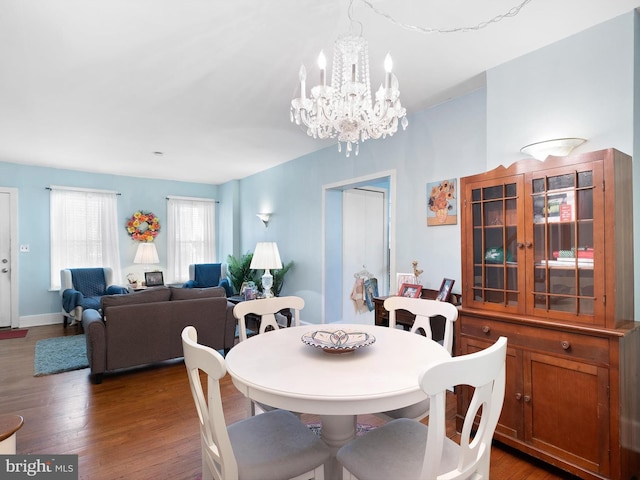 dining room with dark wood-style floors and baseboards