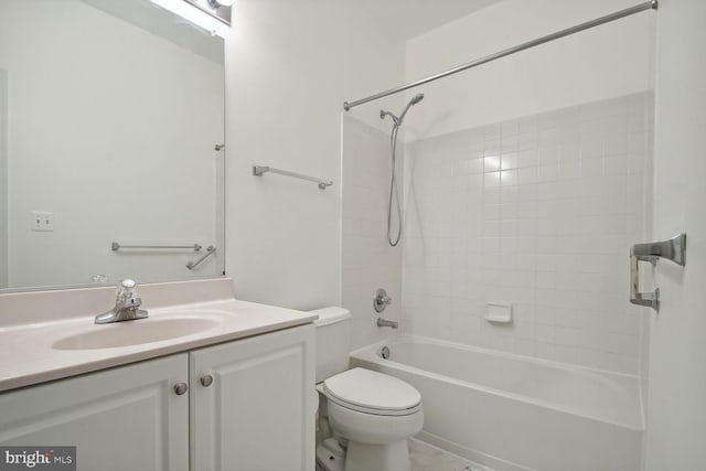 full bathroom with vanity, tiled shower / bath combo, and toilet