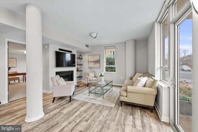 living room with light hardwood / wood-style floors