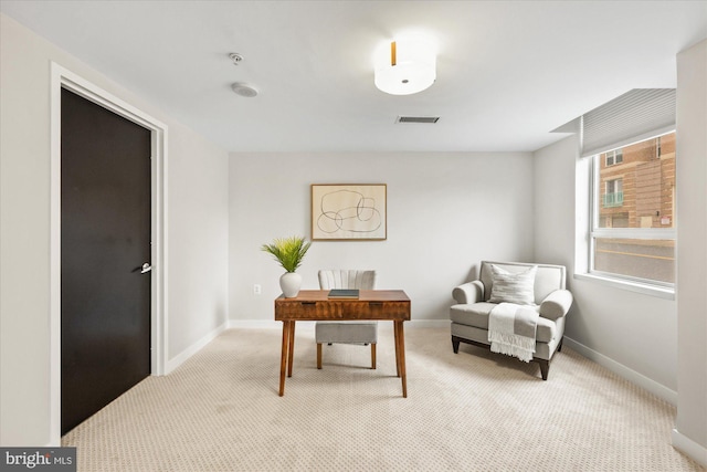 home office featuring light colored carpet