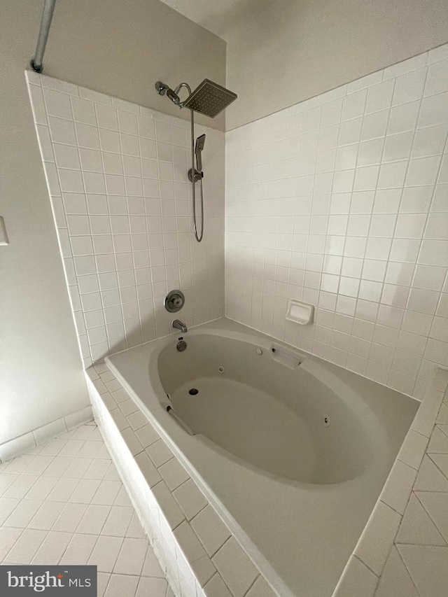 bathroom featuring tiled shower / bath and tile patterned floors