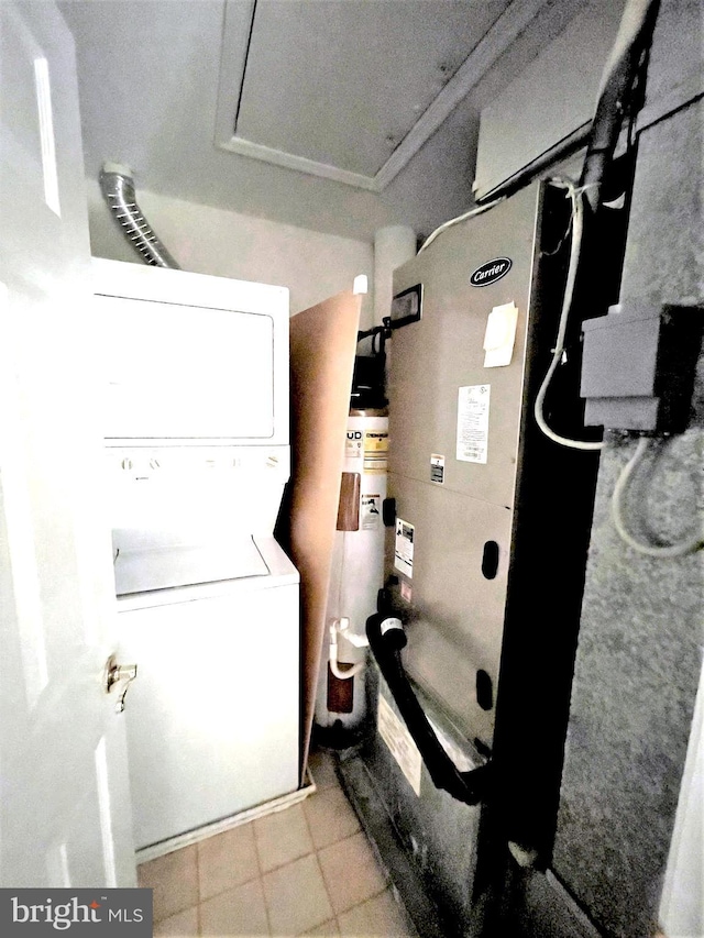 interior space featuring stacked washer and clothes dryer