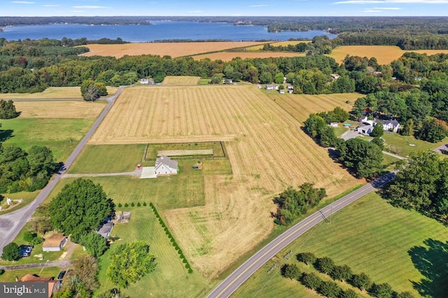 birds eye view of property with a water view and a rural view