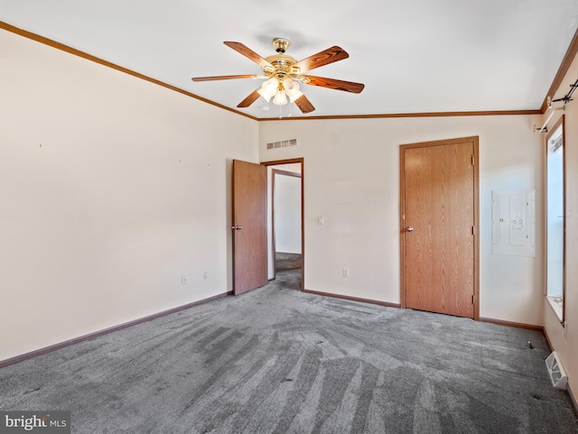 unfurnished bedroom featuring crown molding, vaulted ceiling, carpet flooring, electric panel, and ceiling fan