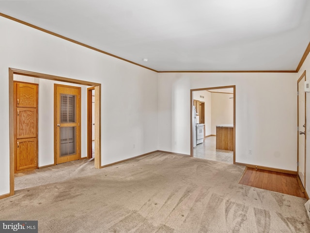 carpeted spare room with ornamental molding