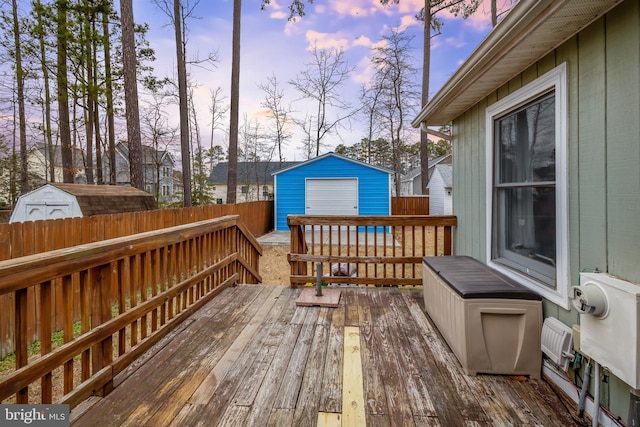 deck featuring a fenced backyard and an outbuilding